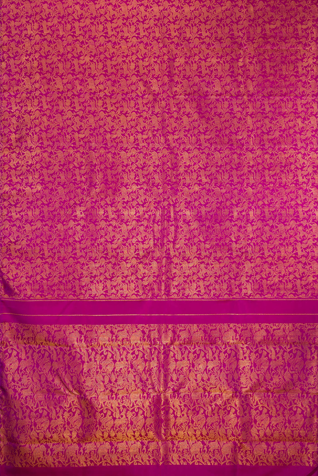 Flat view of Pure Silk Magenta Kanjivaram Saree with Zari Brocade on the body and Without Border. 