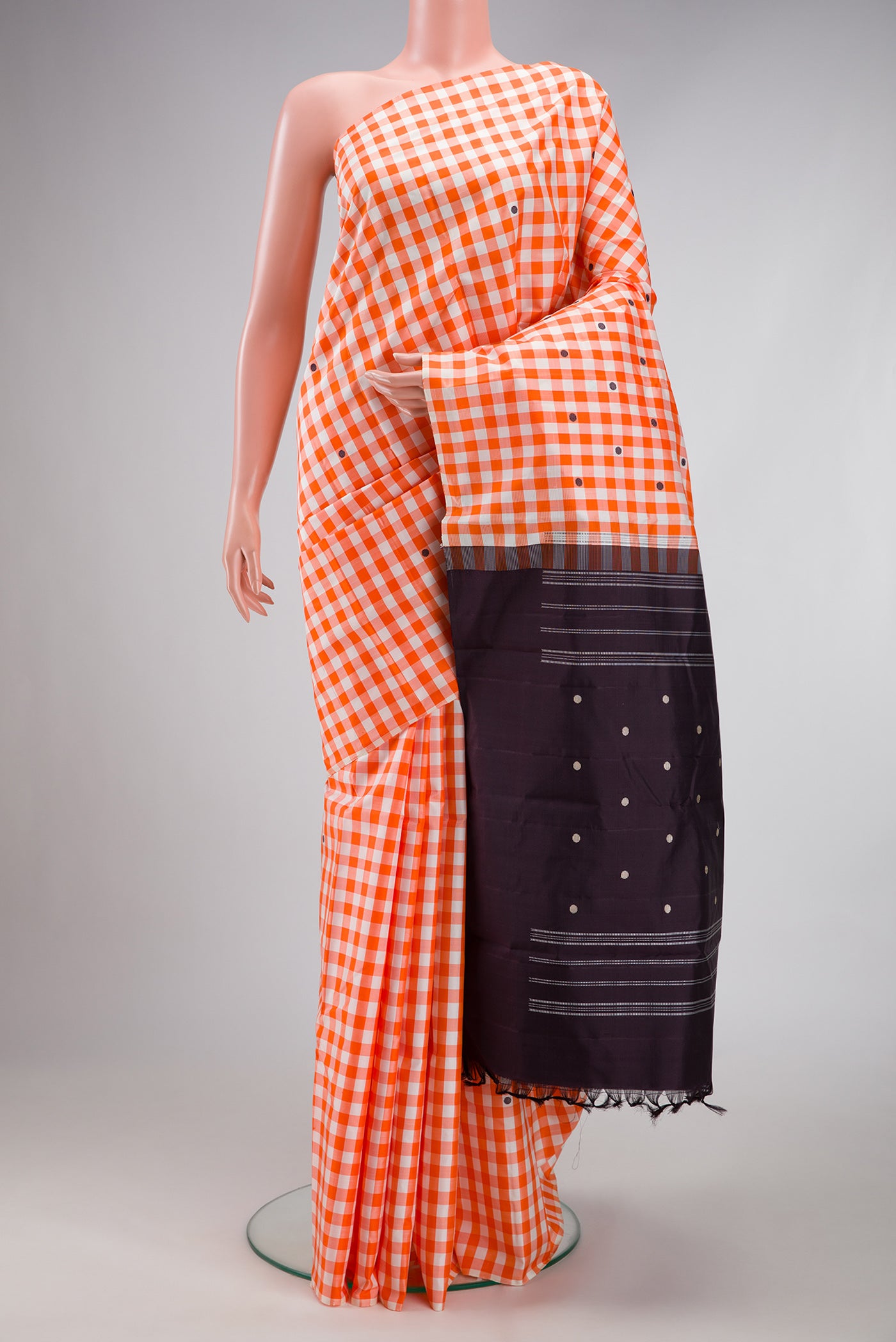 Multi Color Kanjivaram Silk Saree with Checked design on the body and Without Border.  displayed on a mannequin