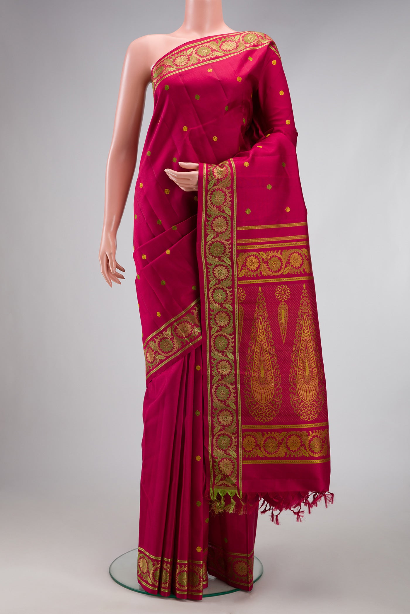 Rani Pink Kanchipuram Silk Saree with Thread Butta on the body and Thread Border.  displayed on a mannequin
