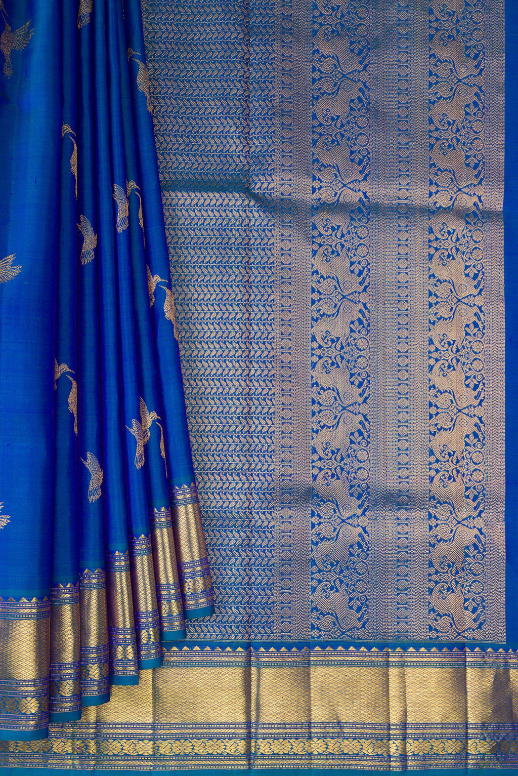 Pleats and pallu of Pure Silk Peacock Blue Dual Tone Kanjivaram Saree with Zari Butta on the body and Zari Border. 