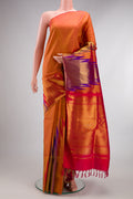 Pure Silk Brick Orange Dual Tone Kanchipuram Saree with Plain Body and Temple Border.  displayed on a mannequin