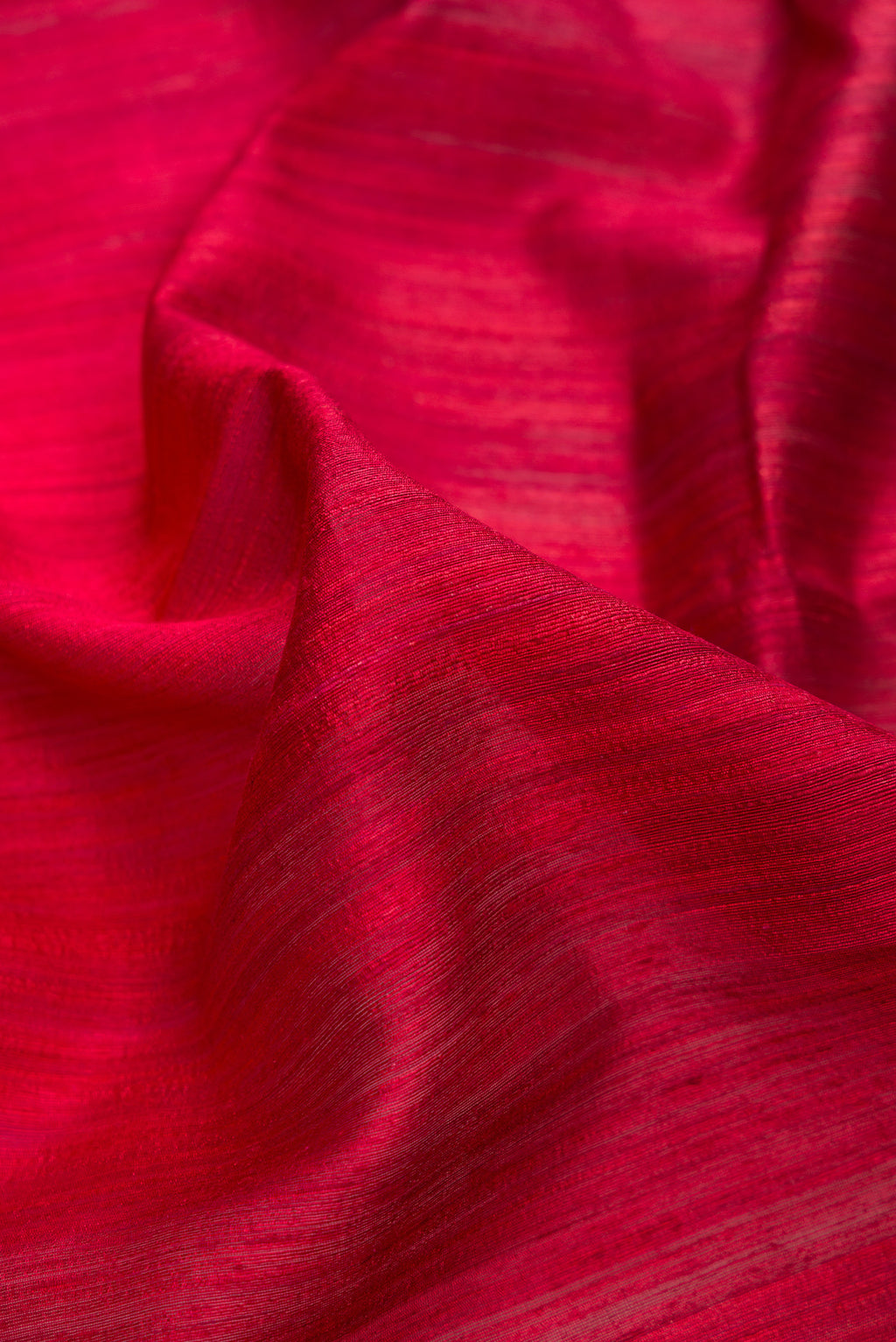 Close up of Multi Color Tussar Saree with Ombre design on the body and Thin Zari Line.  displaying folds