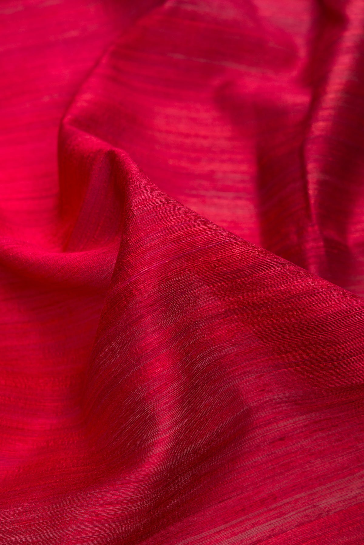 Close up of Multi Color Tussar Saree with Ombre design on the body and Thin Zari Line.  displaying folds