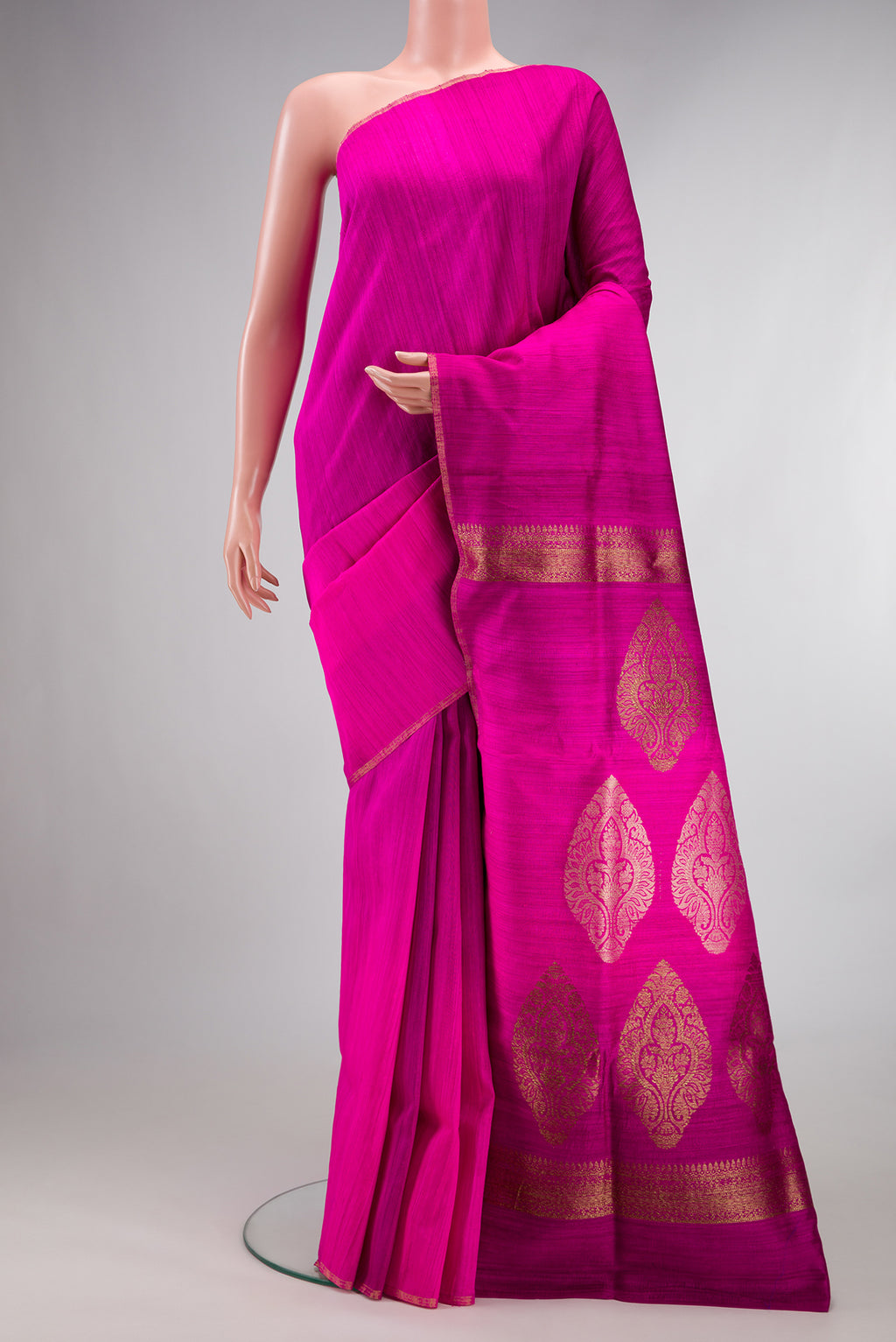 Pure Silk Pink Tussar Saree with Plain Body and Thin Zari Line.  displayed on a mannequin