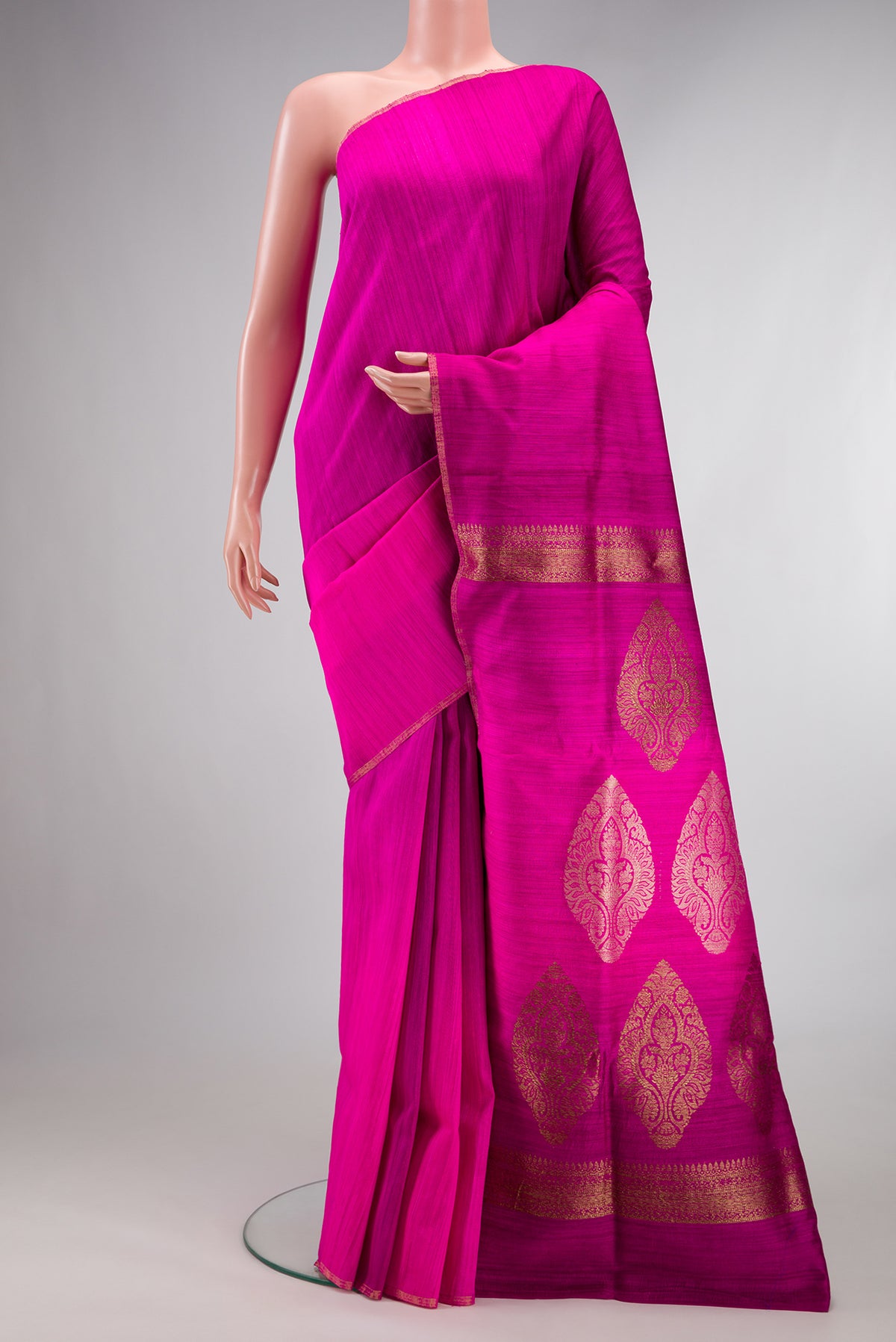 Pure Silk Pink Tussar Saree with Plain Body and Thin Zari Line.  displayed on a mannequin