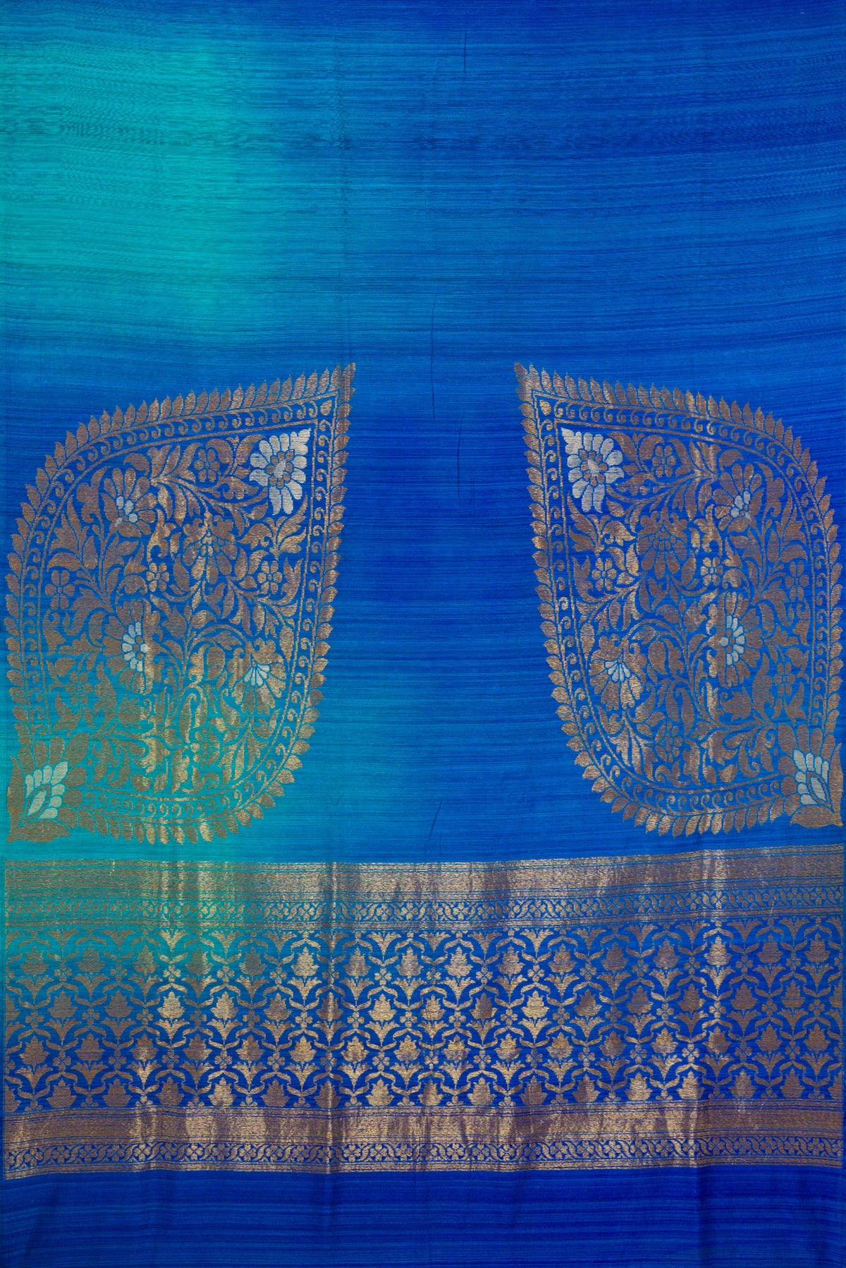 Flat view of Pure Silk Royal Blue and Sea Green Color Tussar Saree with Ombre design on the body and Without Border. 