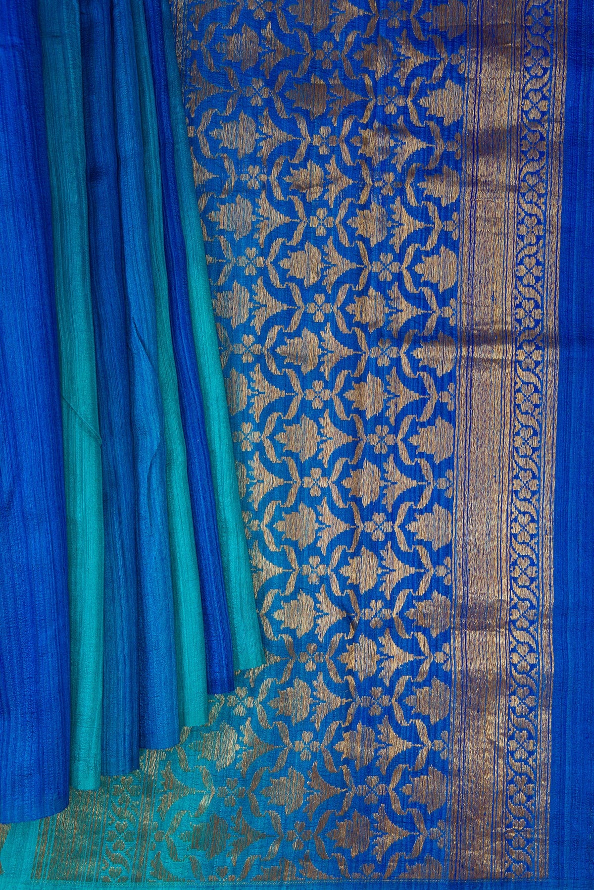 Pleats and pallu of Pure Silk Royal Blue and Sea Green Color Tussar Saree with Ombre design on the body and Without Border. 