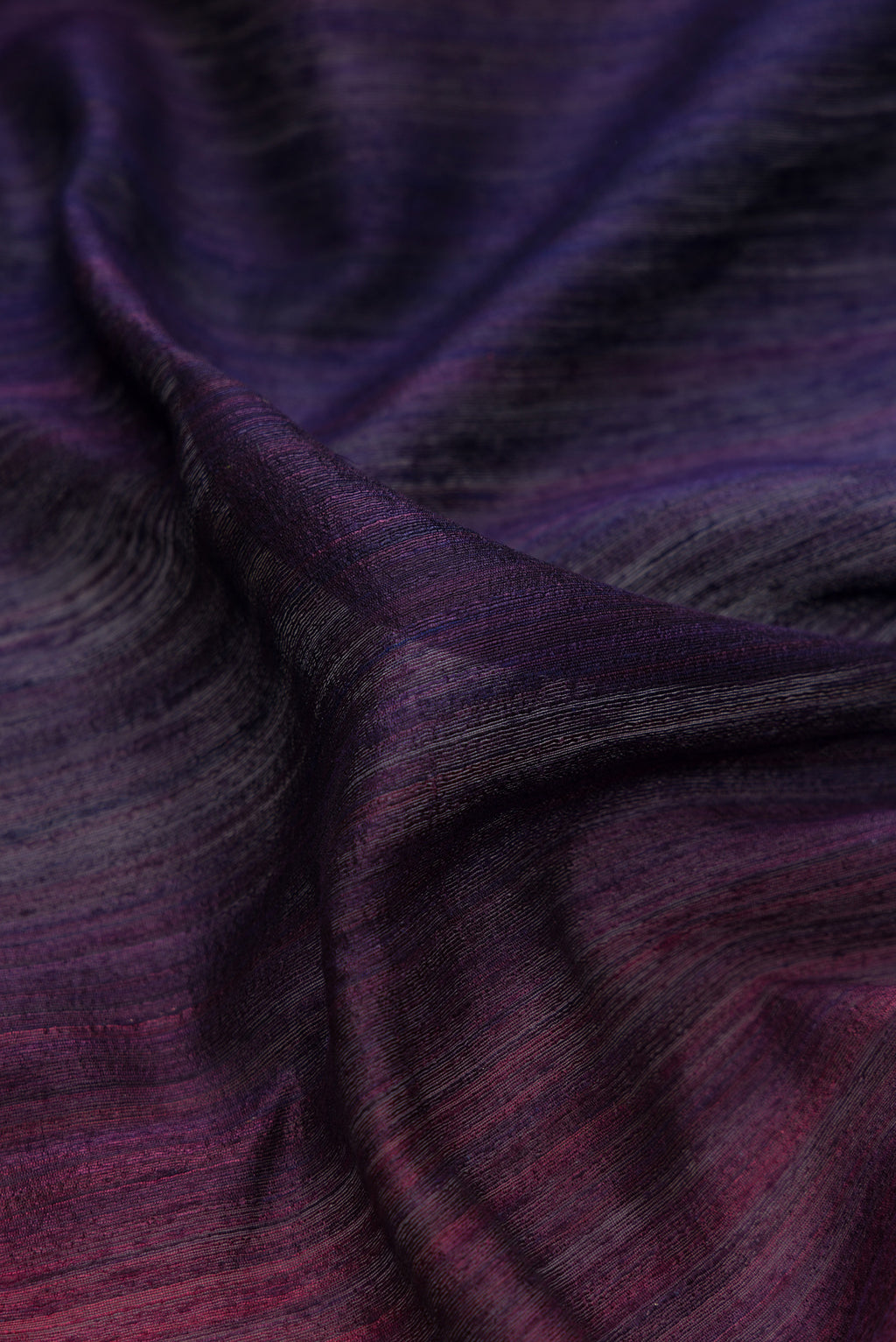 Close up of Pure Silk Multi Color Tussar Saree with Ombre design on the body and Thin Zari Line.  displaying folds