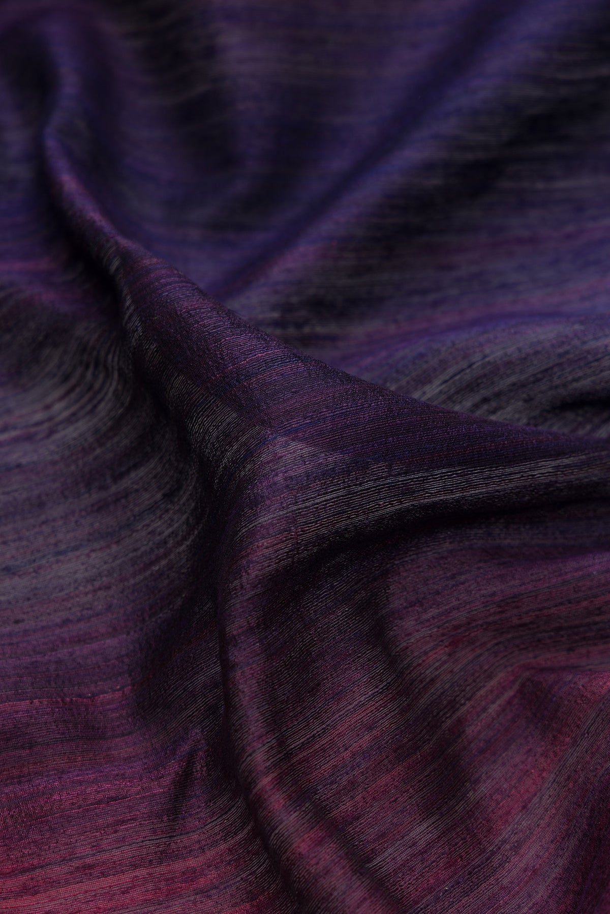 Close up of Pure Silk Multi Color Tussar Saree with Ombre design on the body and Thin Zari Line.  displaying folds