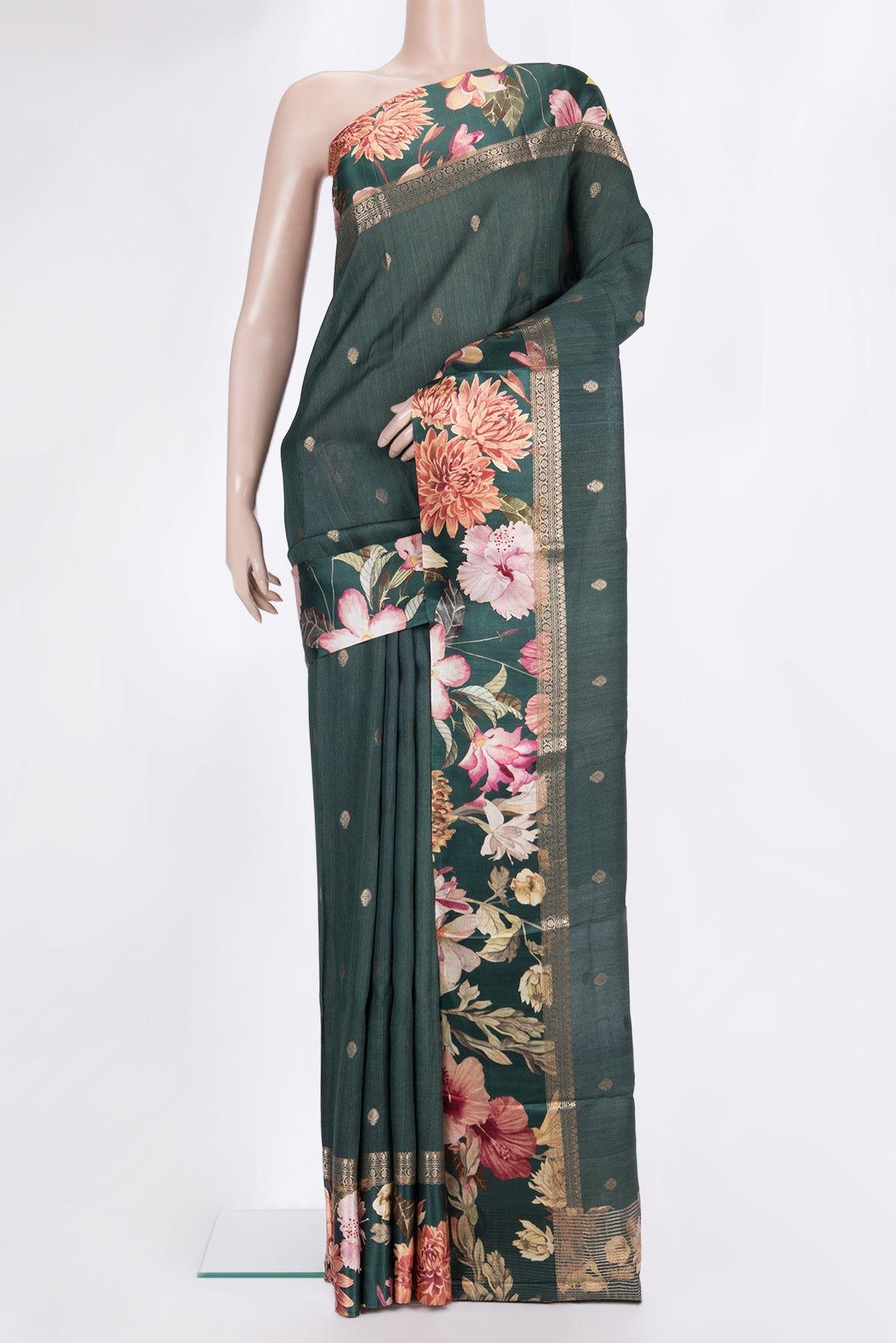 Bottle Green Tussar Saree with Zari Butta on the body and Fancy Border.  displayed on a mannequin