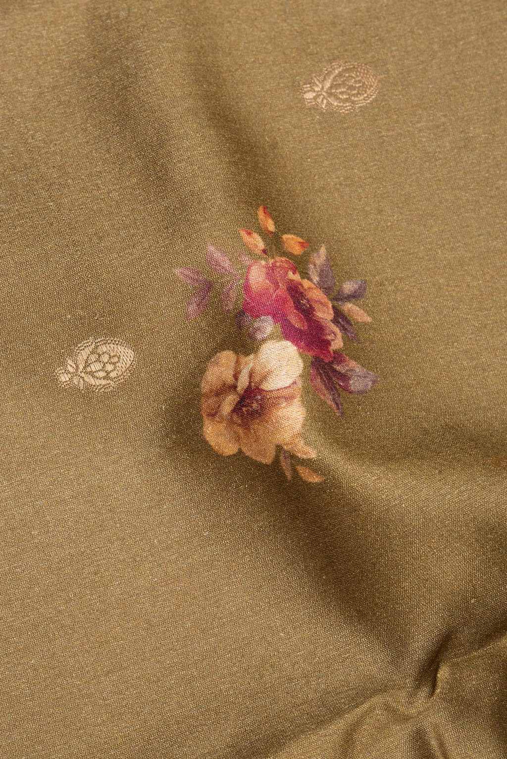 Close up of Brown Tussar Saree with Zari Butta on the body and Fancy Border.  displaying folds