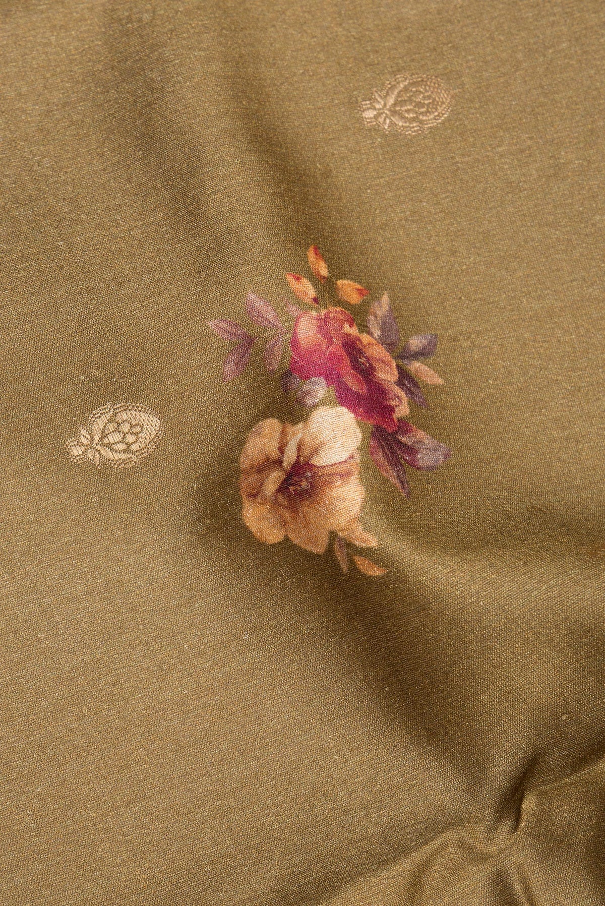Close up of Brown Tussar Saree with Zari Butta on the body and Fancy Border.  displaying folds