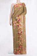 Brown Tussar Saree with Zari Butta on the body and Fancy Border.  displayed on a mannequin
