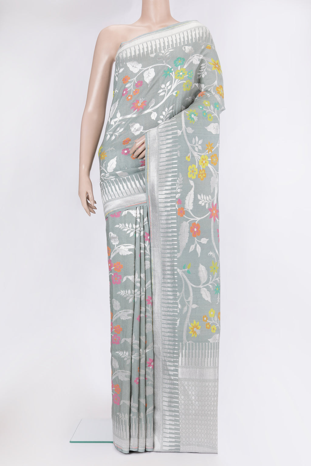 Grey Tussar Silk Saree with Zari Brocade on the body and Fancy Border.  displayed on a mannequin