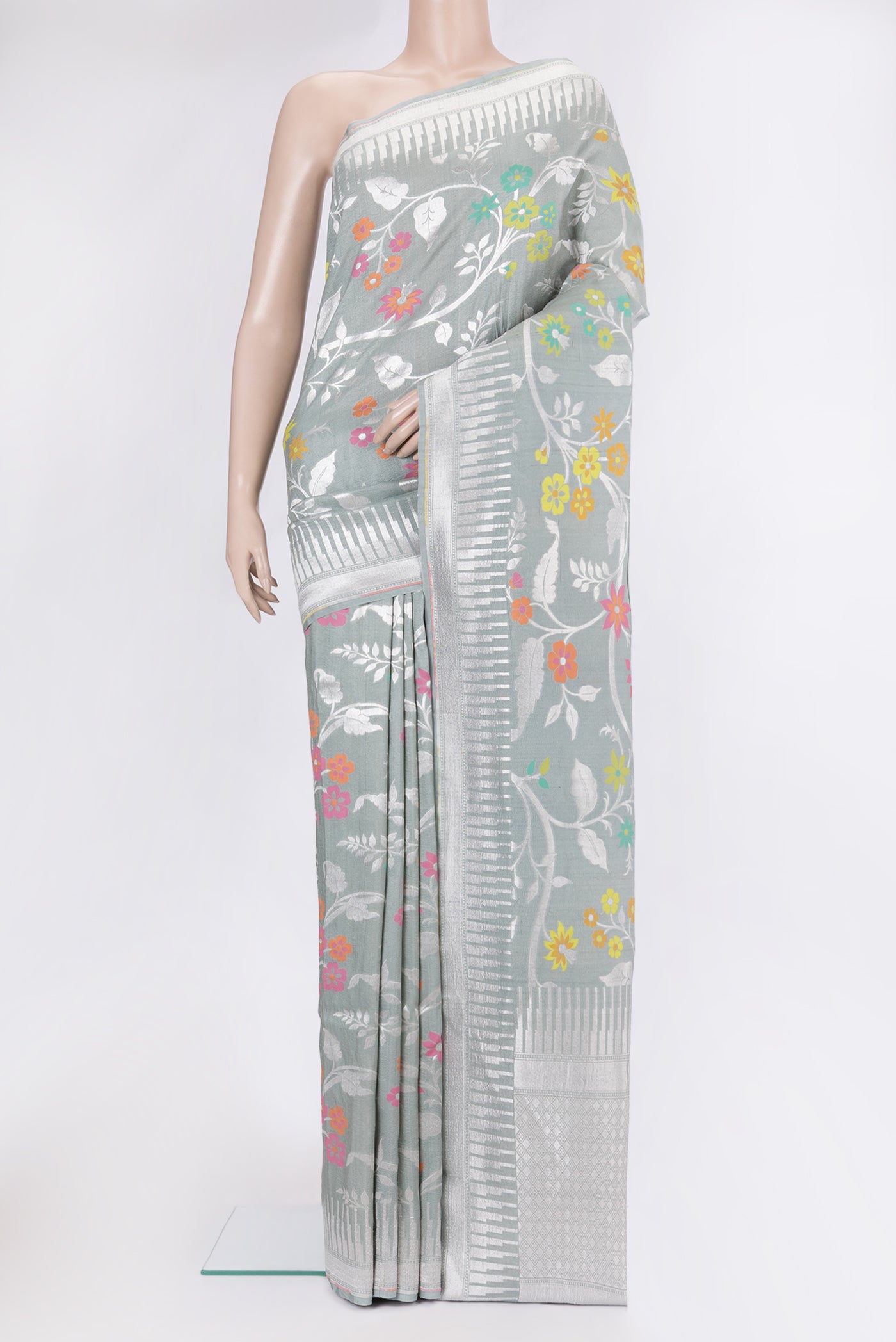 Grey Tussar Silk Saree with Zari Brocade on the body and Fancy Border.  displayed on a mannequin