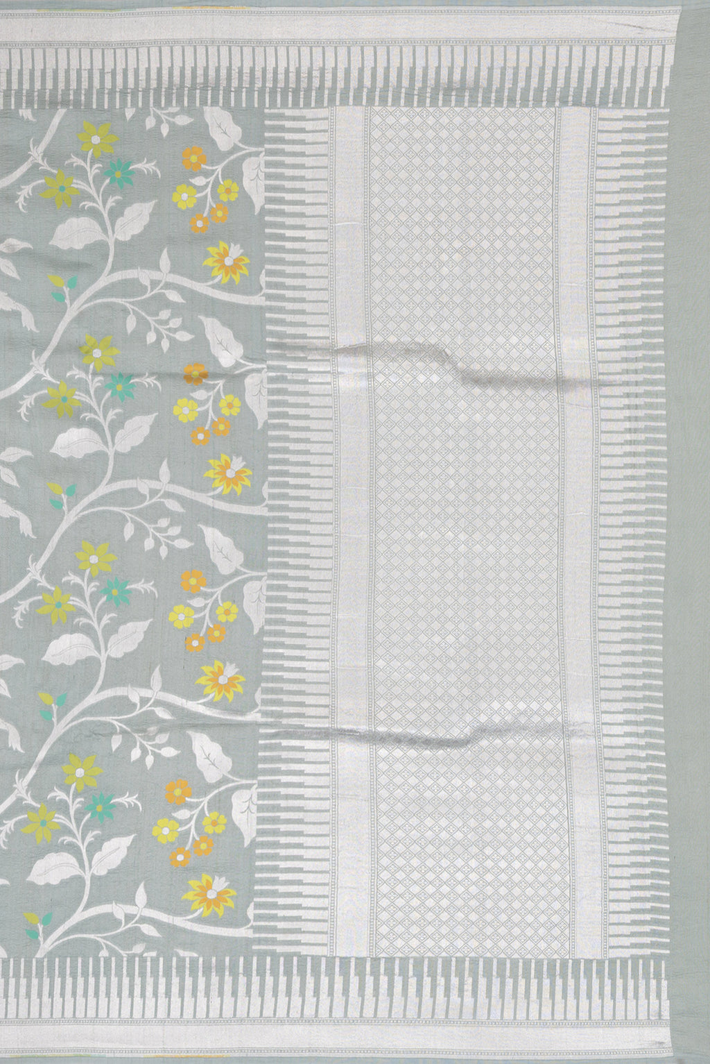 Close up image of the pallu of Grey Tussar Silk Saree with Zari Brocade on the body and Fancy Border. 