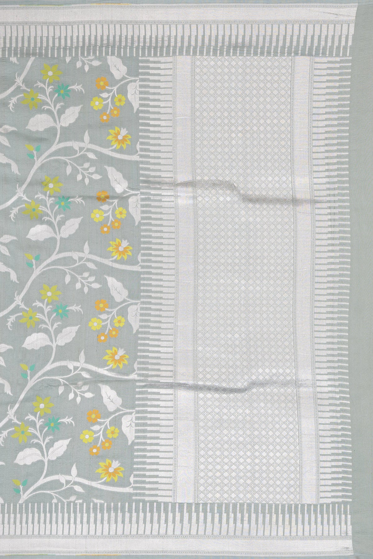 Close up image of the pallu of Grey Tussar Silk Saree with Zari Brocade on the body and Fancy Border. 