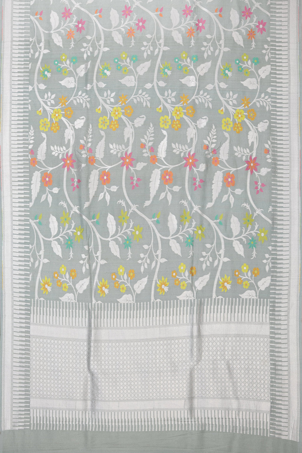 Flat view of Grey Tussar Silk Saree with Zari Brocade on the body and Fancy Border. 