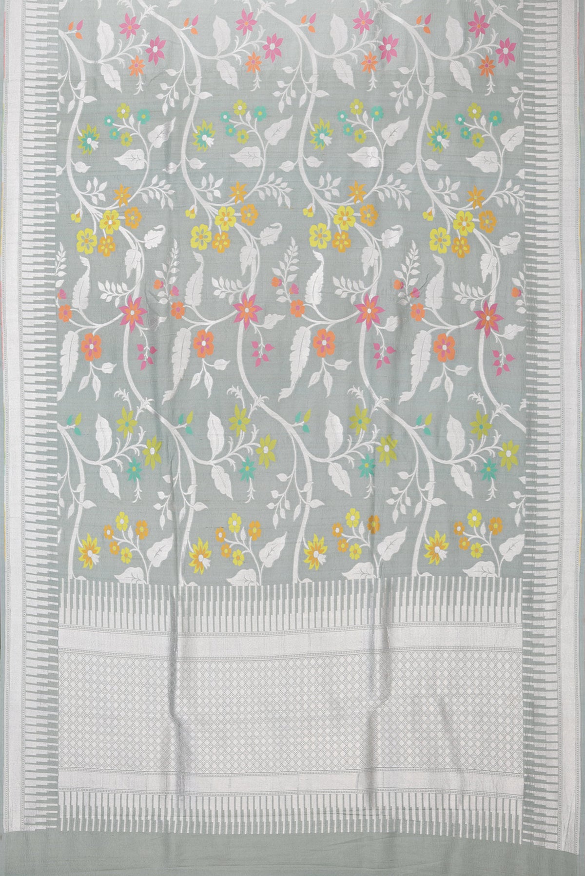 Flat view of Grey Tussar Silk Saree with Zari Brocade on the body and Fancy Border. 