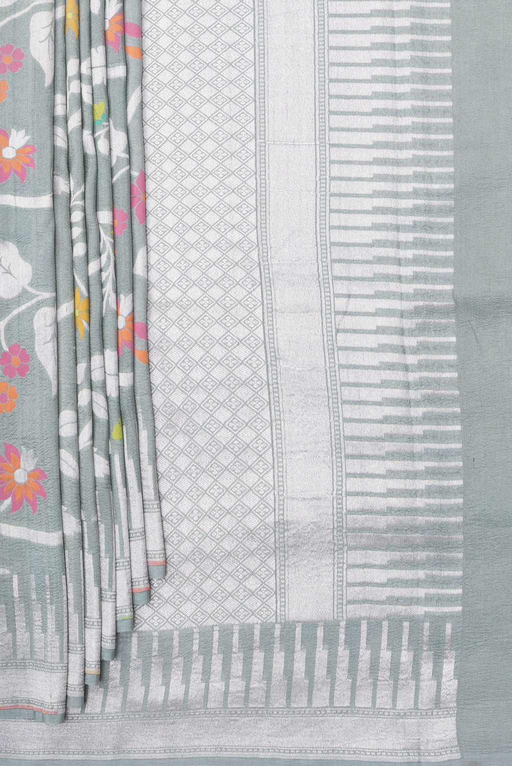 Pleats and pallu of Grey Tussar Silk Saree with Zari Brocade on the body and Fancy Border. 
