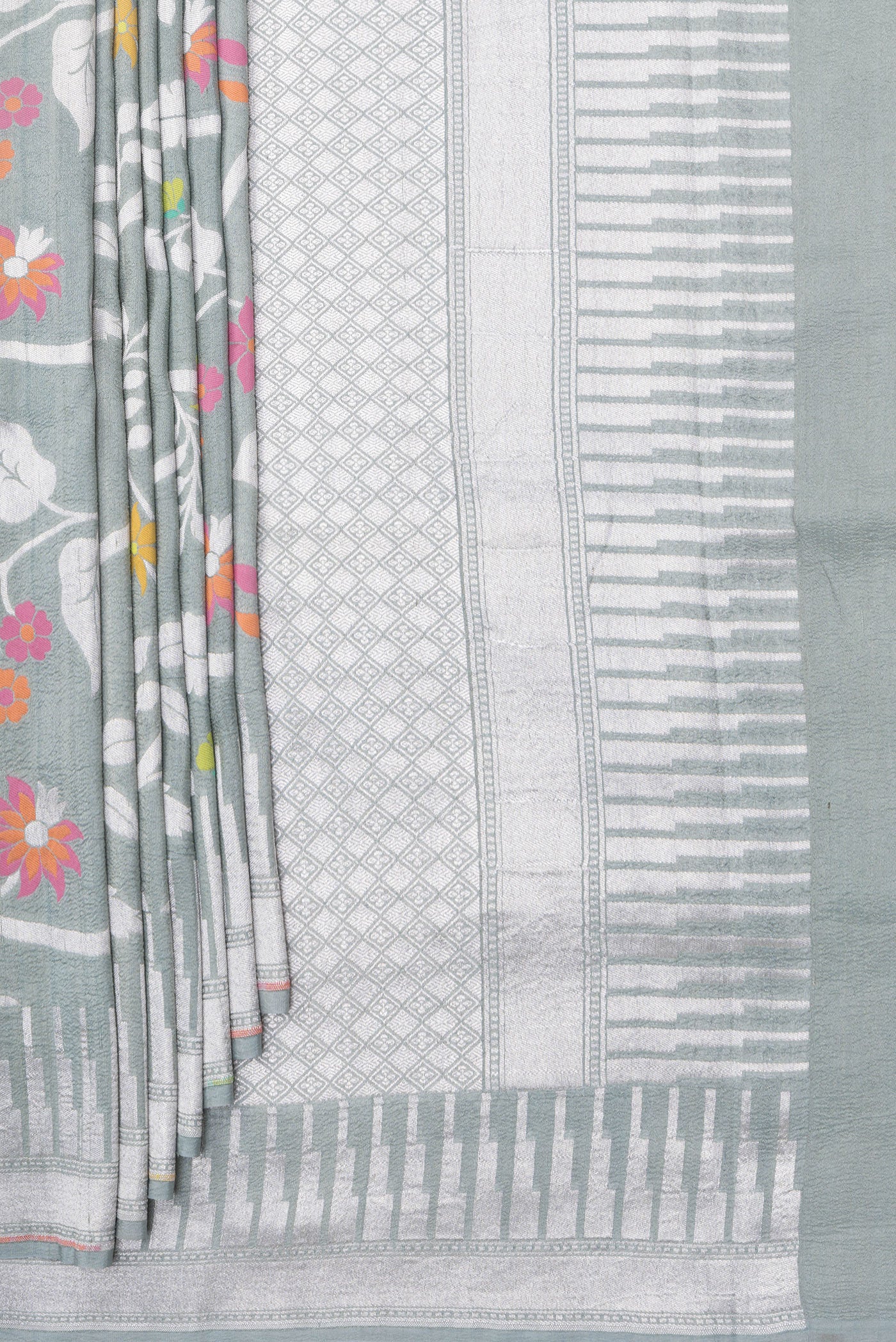 Pleats and pallu of Grey Tussar Silk Saree with Zari Brocade on the body and Fancy Border. 