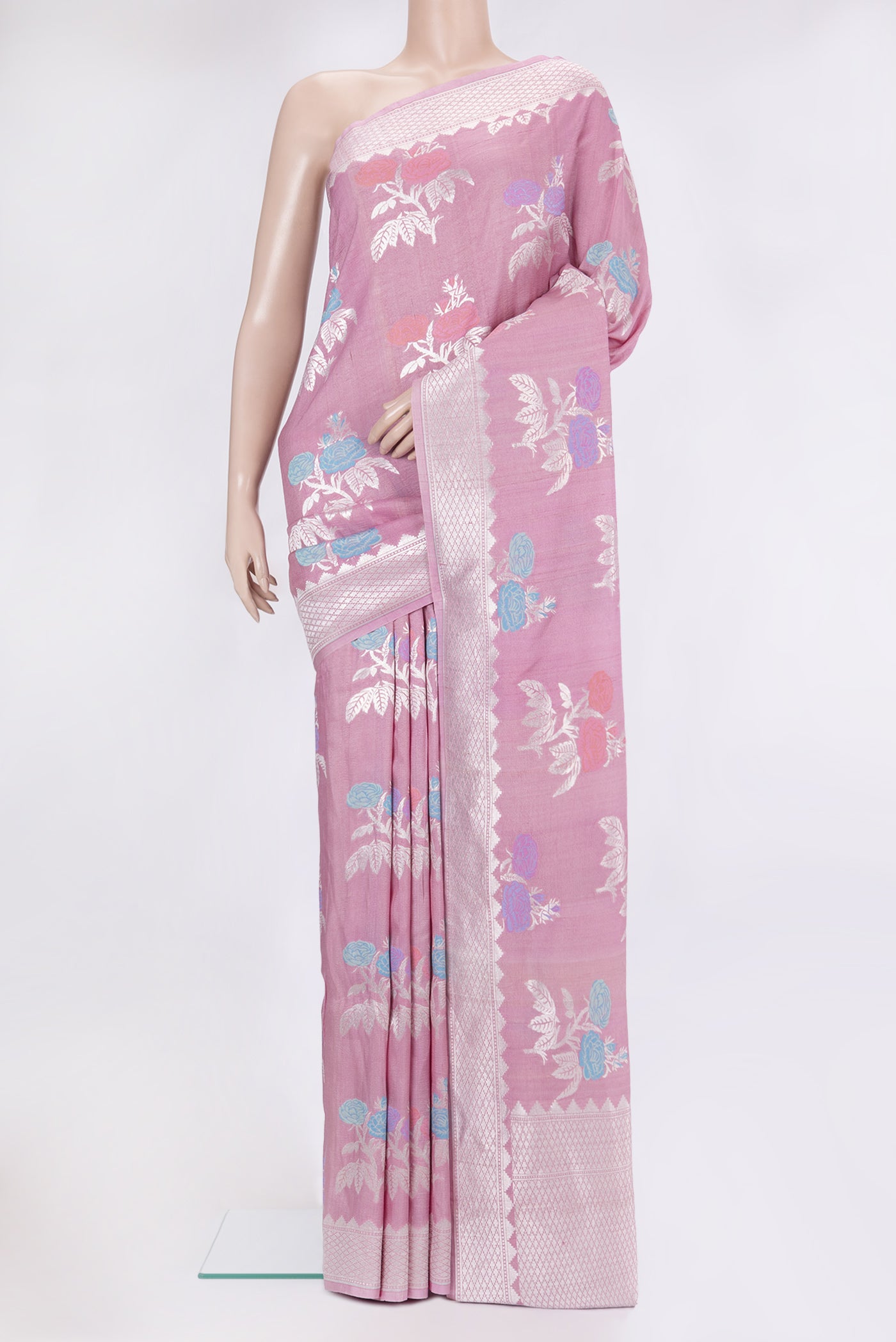 Pink Tussar Silk Saree with Zari And Thread Butta on the body and Fancy Border.  displayed on a mannequin
