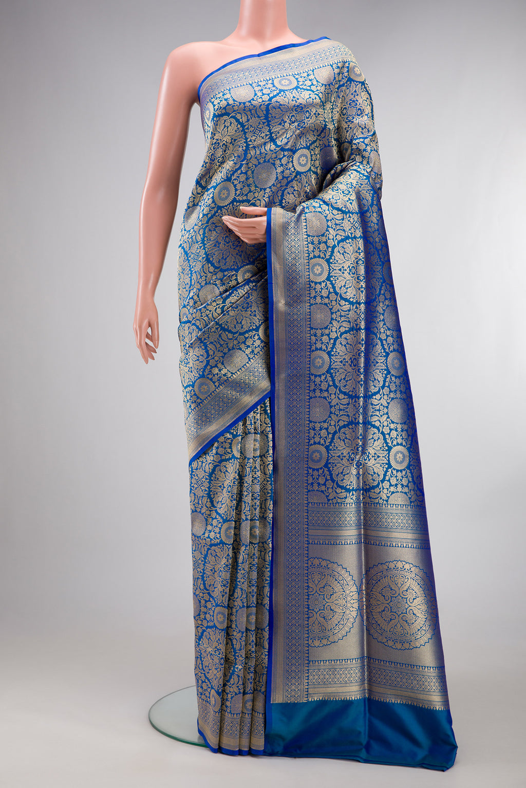 Pure Silk Royal Blue Dual Tone Banarasi Saree with Zari Brocade on the body and Zari Border.  displayed on a mannequin