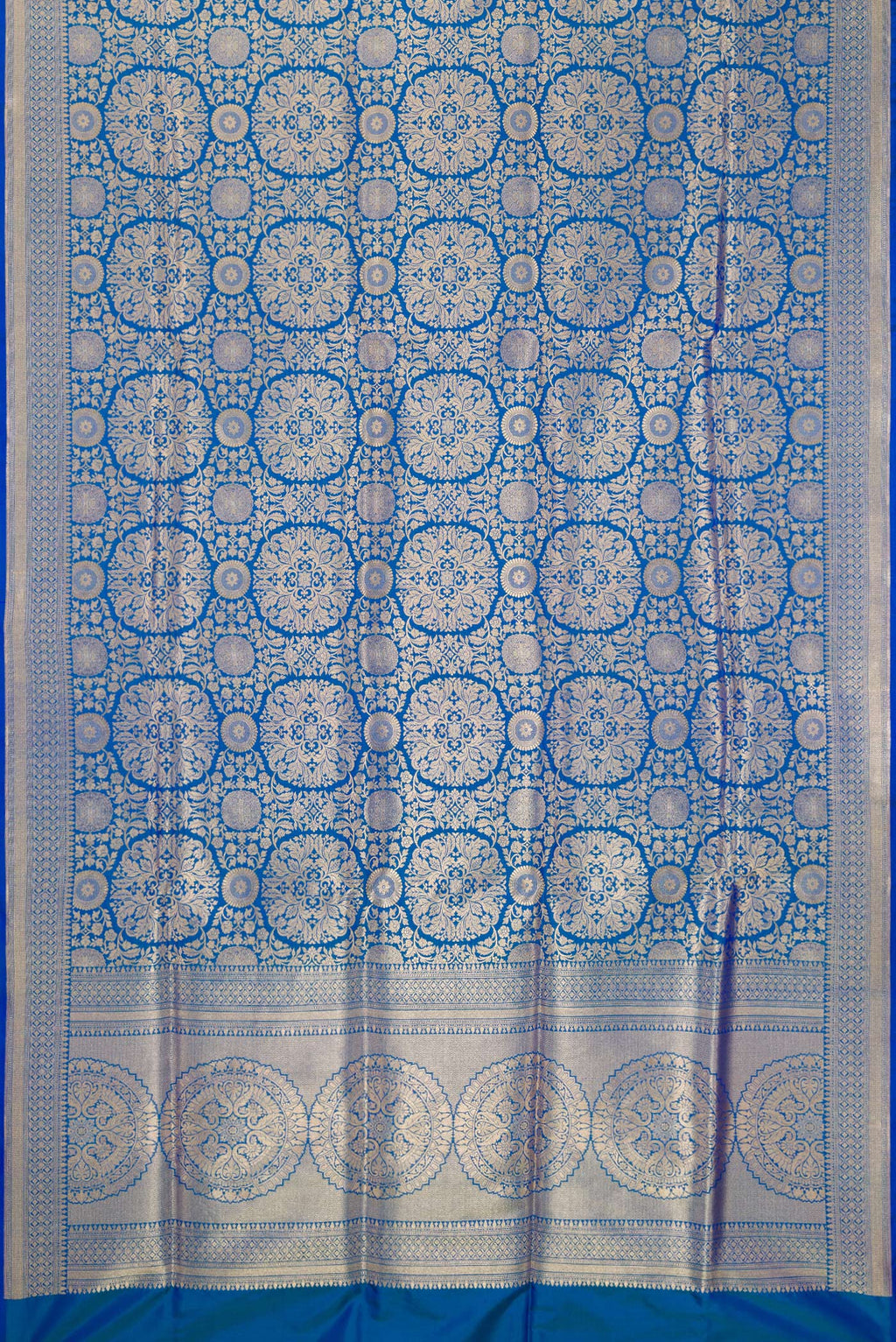 Flat view of Pure Silk Royal Blue Dual Tone Banarasi Saree with Zari Brocade on the body and Zari Border. 