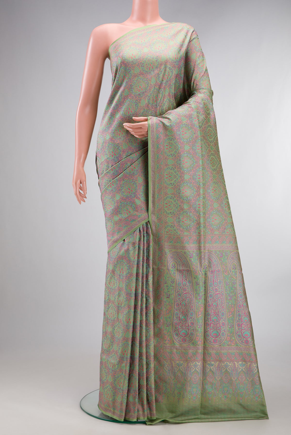 Pure Silk Pista Green Banarasi Saree with Jacquard design on the body and Thread Border.  displayed on a mannequin