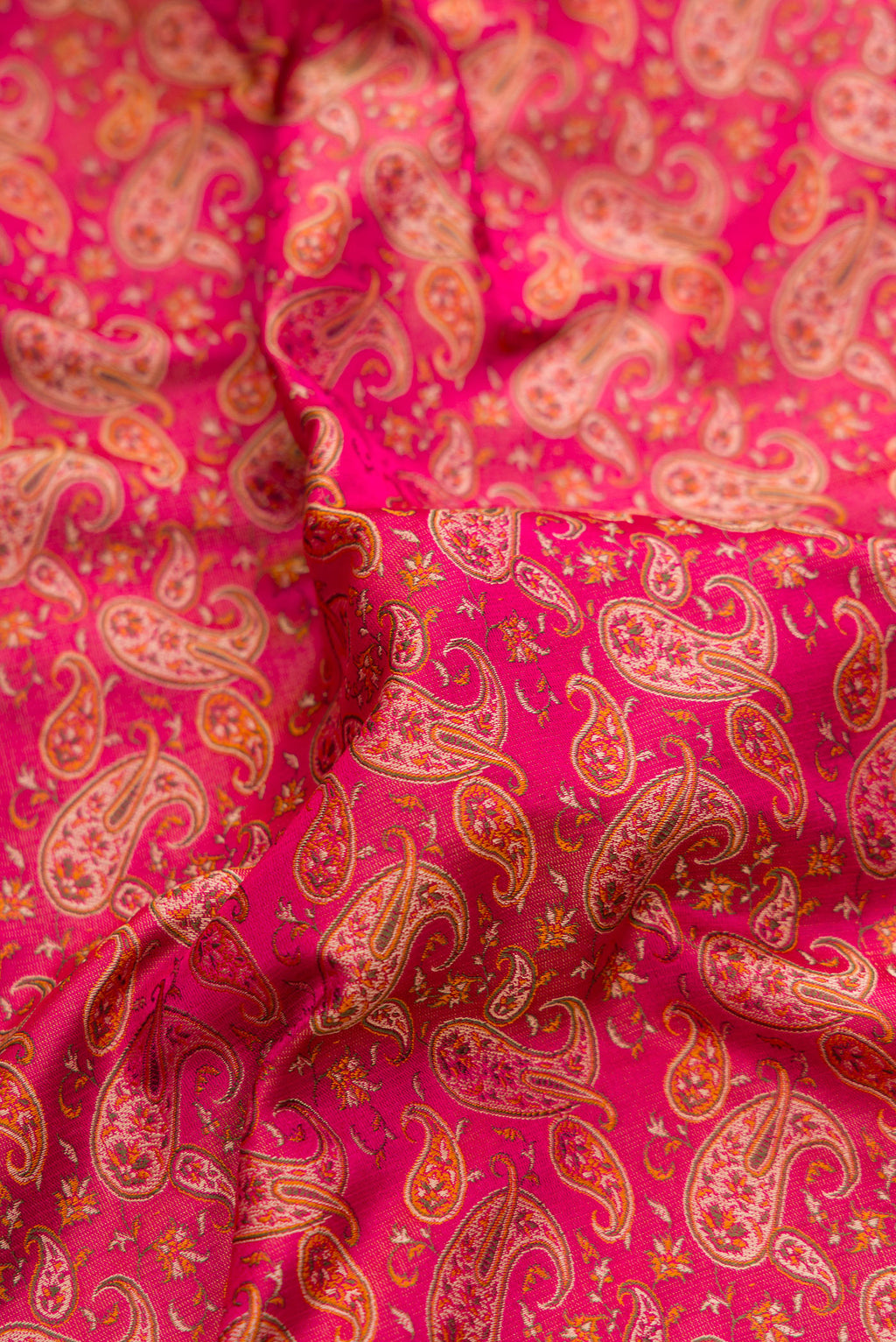 Close up of Pure Silk Dark Pink Dual Tone Banarasi Tanchoi Saree with Jacquard design on the body and Thread Border.  displaying folds