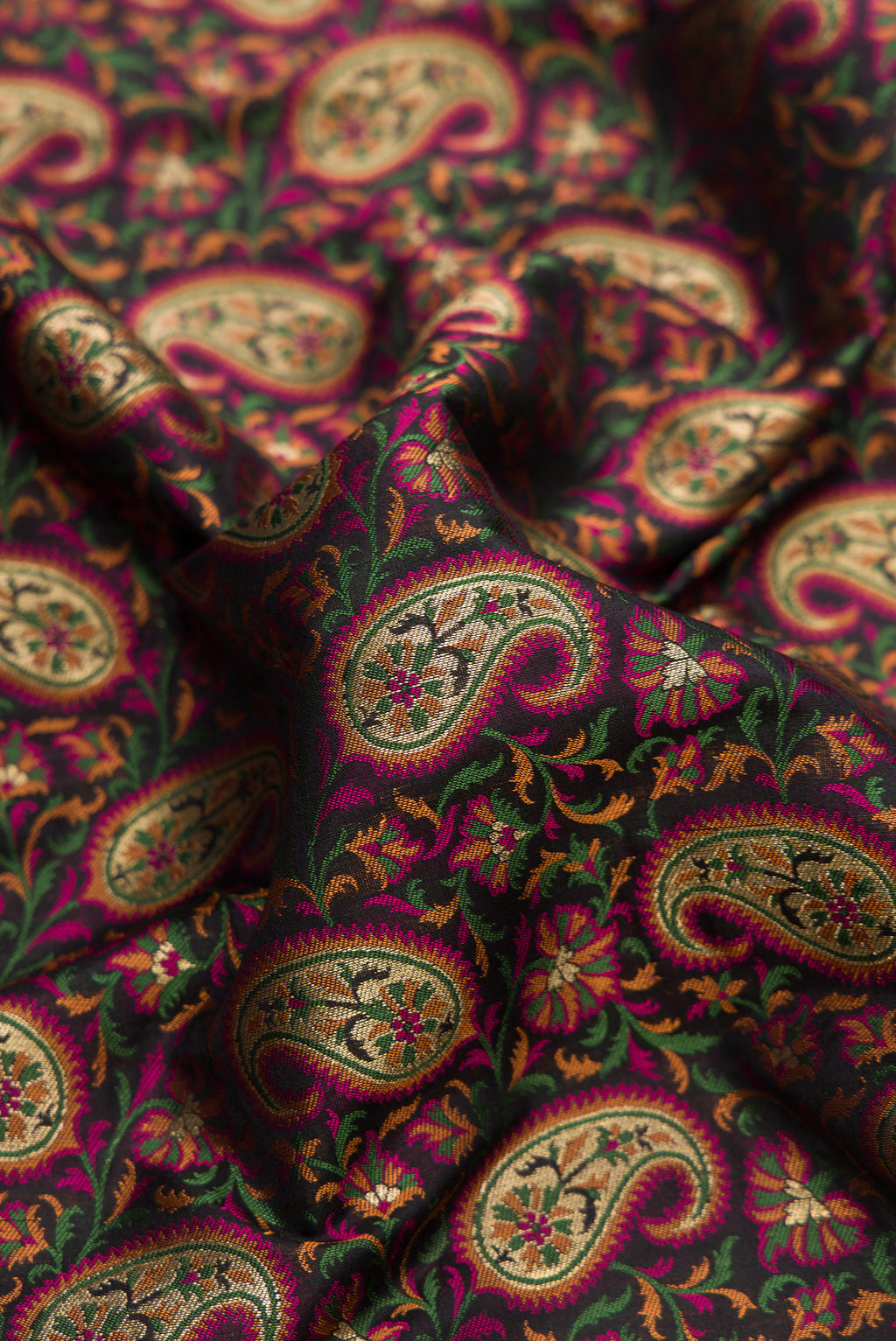 Close up of Pure Silk Black Banarasi Jamavar Saree with Jacquard design on the body and Thread Border.  displaying folds
