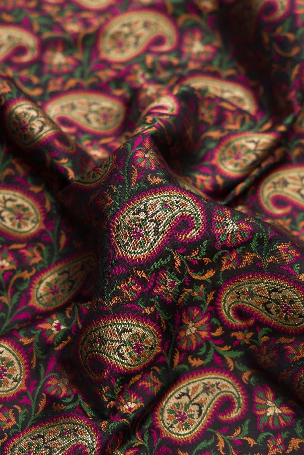 Close up of Pure Silk Black Banarasi Jamavar Saree with Jacquard design on the body and Thread Border.  displaying folds