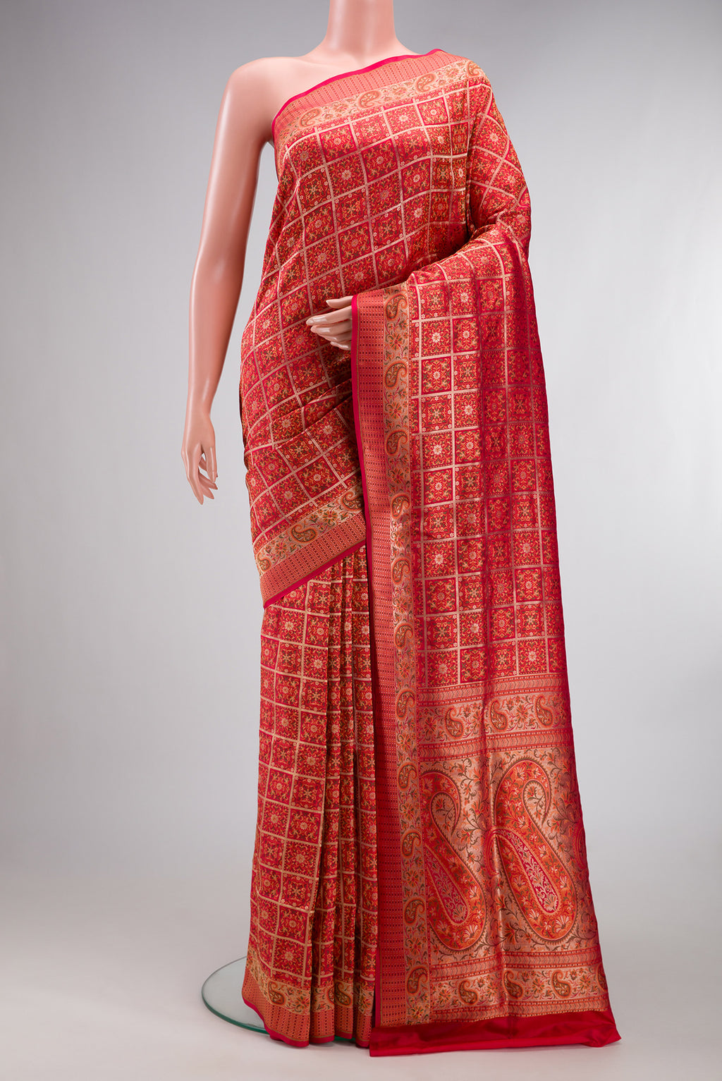 Pure Silk Red Banarasi Jamavar Saree with Jacquard design on the body and Fancy Border.  displayed on a mannequin