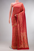 Pure Silk Red Banarasi Jamavar Saree with Jacquard design on the body and Fancy Border.  displayed on a mannequin