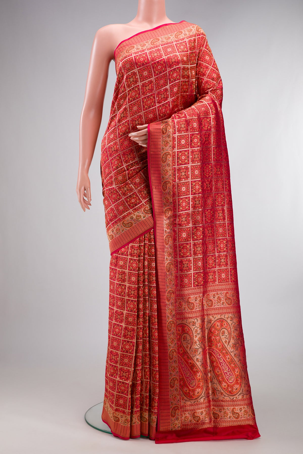 Pure Silk Red Banarasi Jamavar Saree with Jacquard design on the body and Fancy Border.  displayed on a mannequin