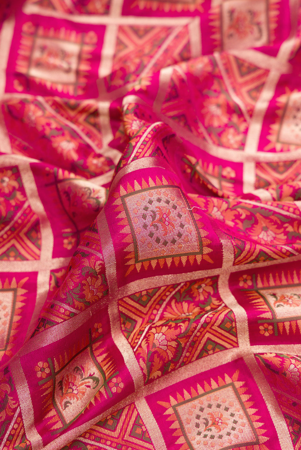 Close up of Pure Silk Dark Pink Banarasi Jamavar Saree with Zari Brocade on the body and Fancy Border.  displaying folds
