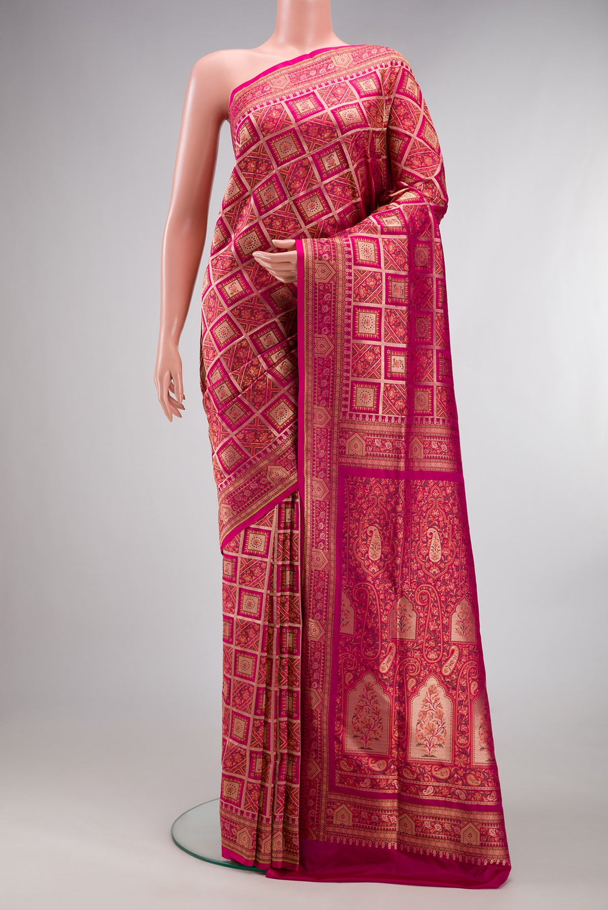 Pure Silk Dark Pink Banarasi Jamavar Saree with Zari Brocade on the body and Fancy Border.  displayed on a mannequin