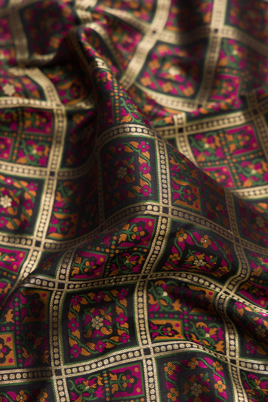 Close up of Pure Silk Black Banarasi Jamavar Saree with Zari Brocade on the body and Fancy Border.  displaying folds