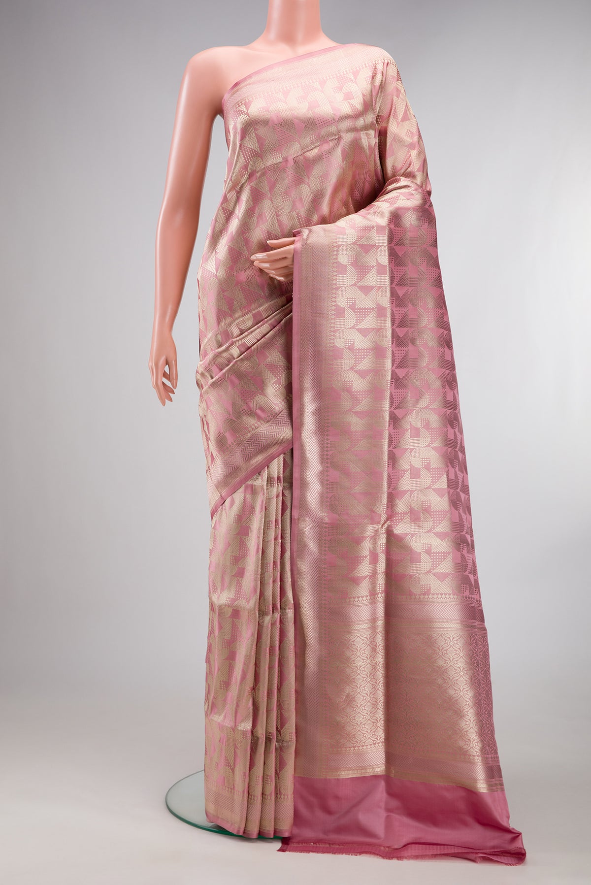 Pure Silk Rose Gold Dual Tone Banarasi Saree with Zari Brocade on the body and Fancy Border.  displayed on a mannequin