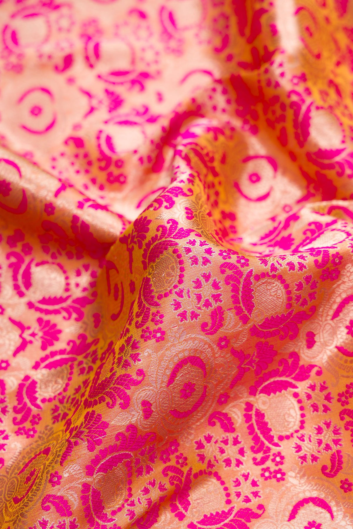 Close up of Pure Silk Pink Dual Tone Banarasi Saree with Jacquard design on the body and Zari Border.  displaying folds