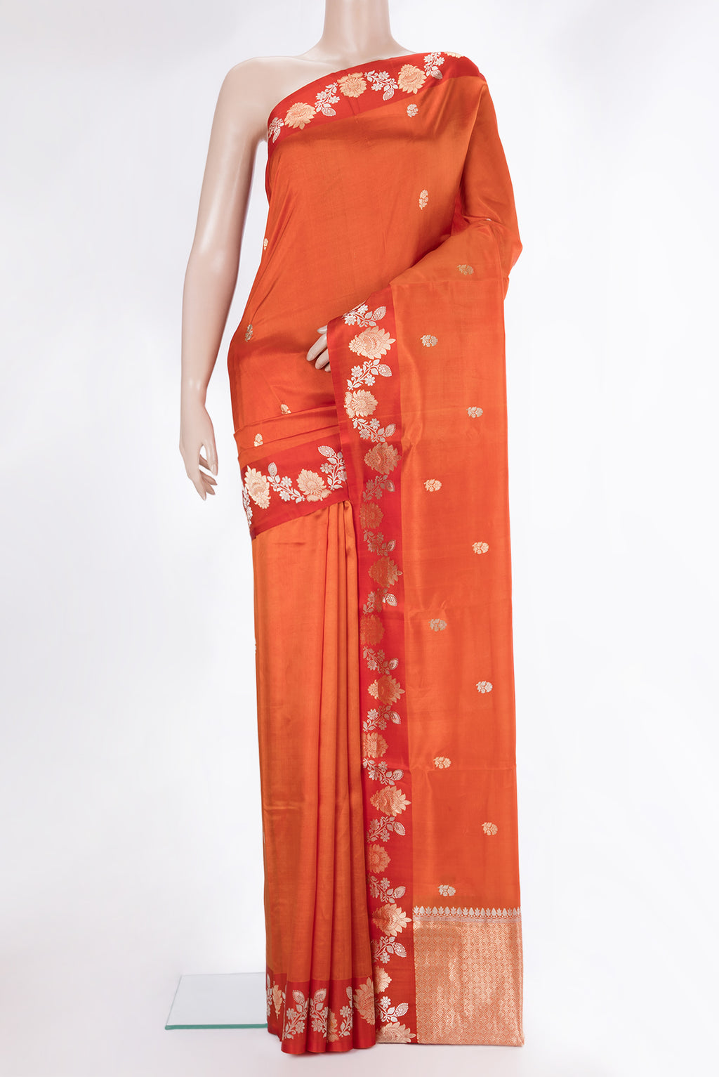 Pure Silk Orange Dual Tone Tussar Saree with Zari Butta on the body and Fancy Border.  displayed on a mannequin