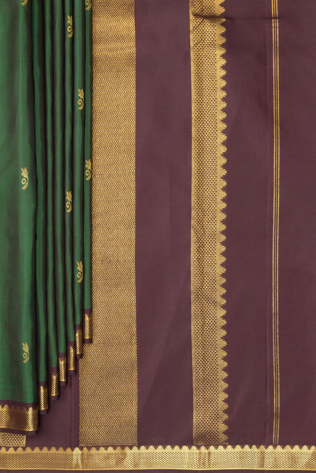 Pleats and pallu of Pure Silk Green Kanchipuram Saree with Zari Butta on the body and Zari Border. 