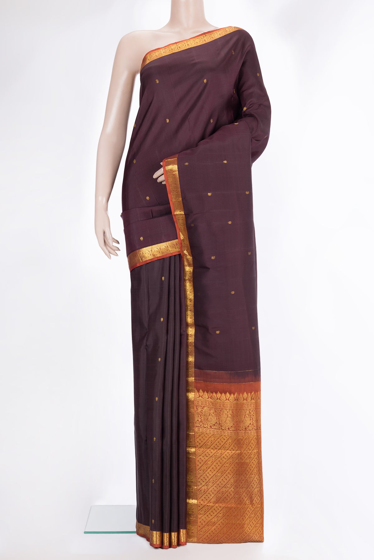 Pure Silk Brown Kanchipuram Saree with Zari Butta on the body and Zari Border.  displayed on a mannequin