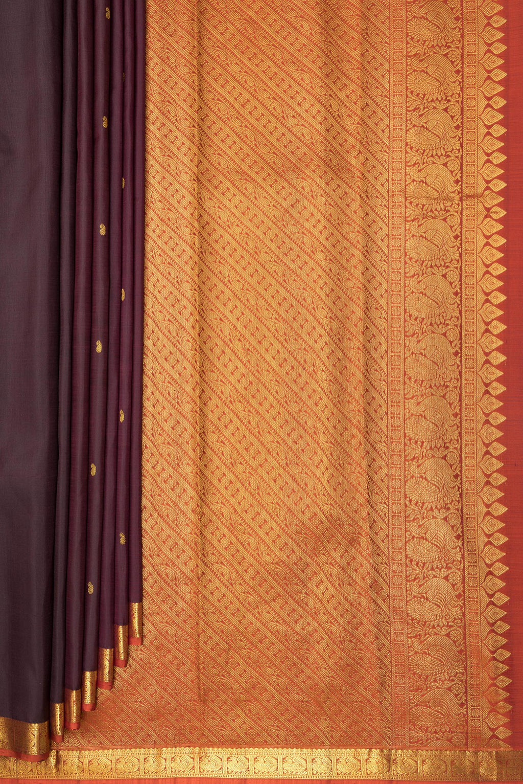 Pleats and pallu of Pure Silk Brown Kanchipuram Saree with Zari Butta on the body and Zari Border. 
