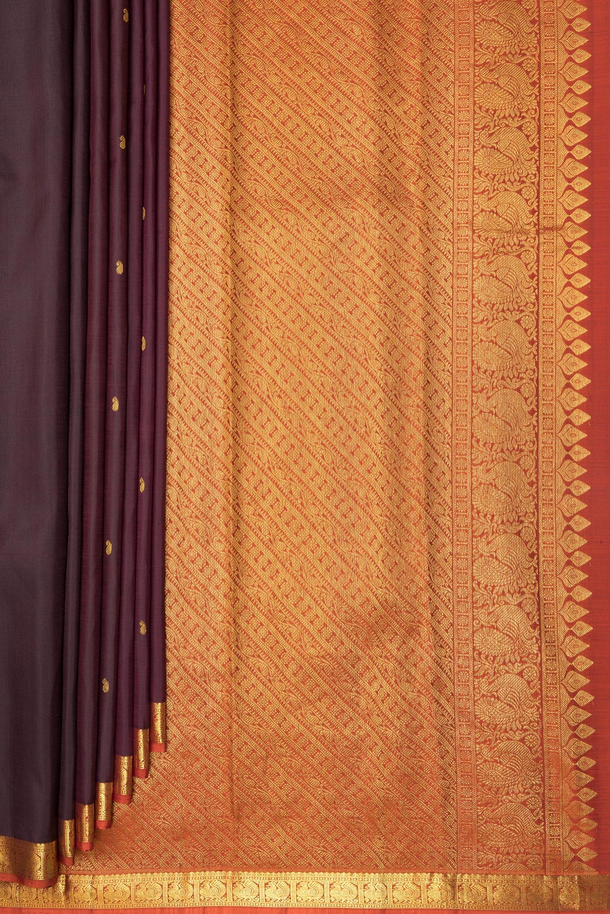 Pleats and pallu of Pure Silk Brown Kanchipuram Saree with Zari Butta on the body and Zari Border. 