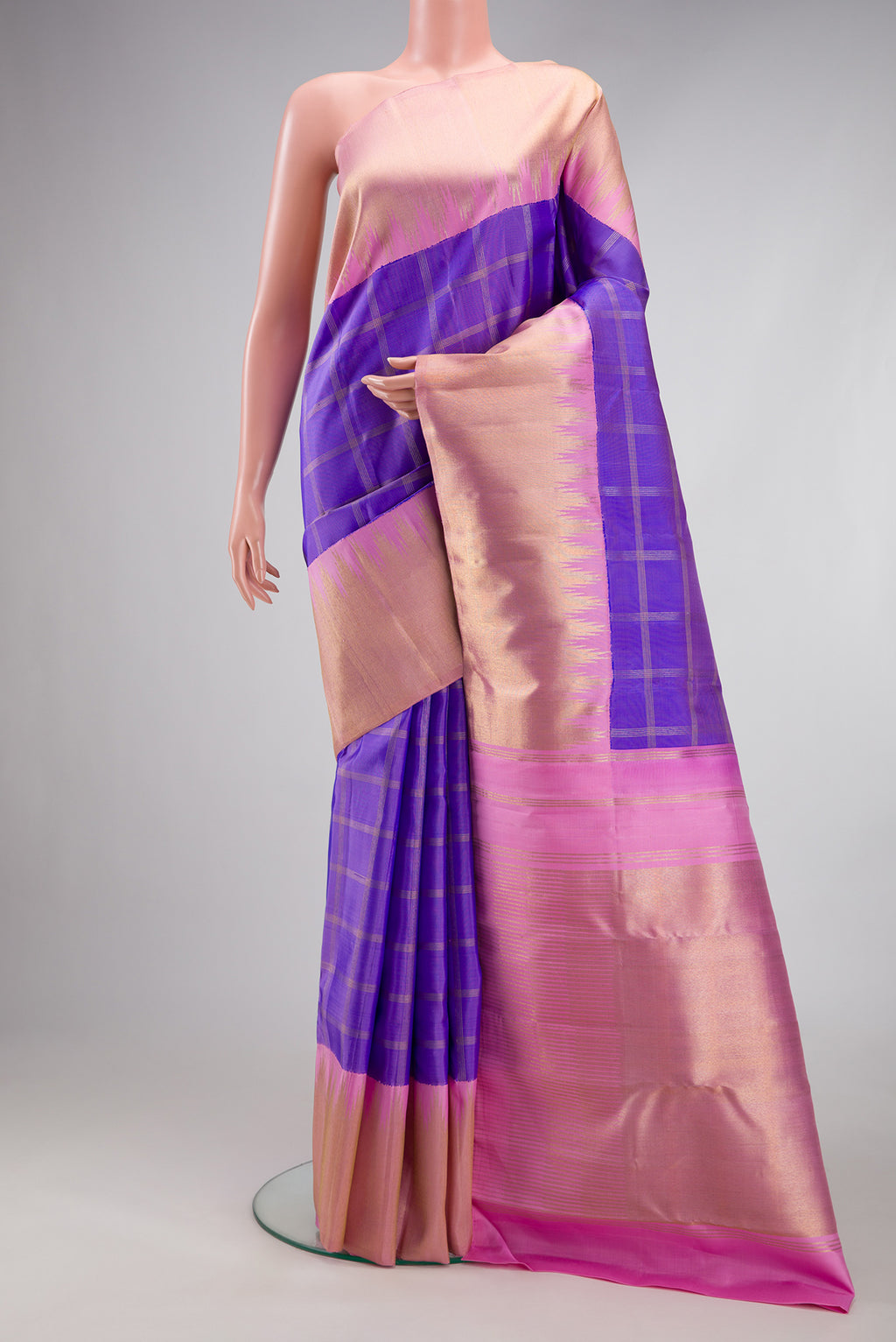 Pure Silk Pure Zari Lavender Kanjivaram Saree with Checked design on the body and Zari Border.  displayed on a mannequin