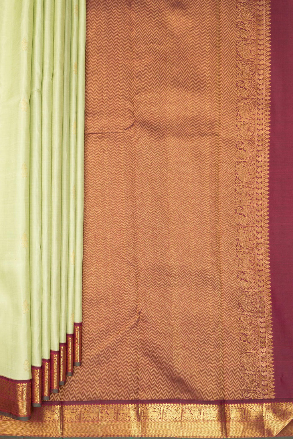Pleats and pallu of Pure Silk Pista Green Kanjivaram Saree with Zari Butta on the body and Zari Border. 