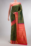Pure Silk Bottle Green Kanchipuram Saree with Zari Brocade on the body and Zari Border.  displayed on a mannequin