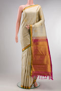 Pure Silk Beige Kanjivaram Saree with Jacquard design on the body and Zari Border.  displayed on a mannequin