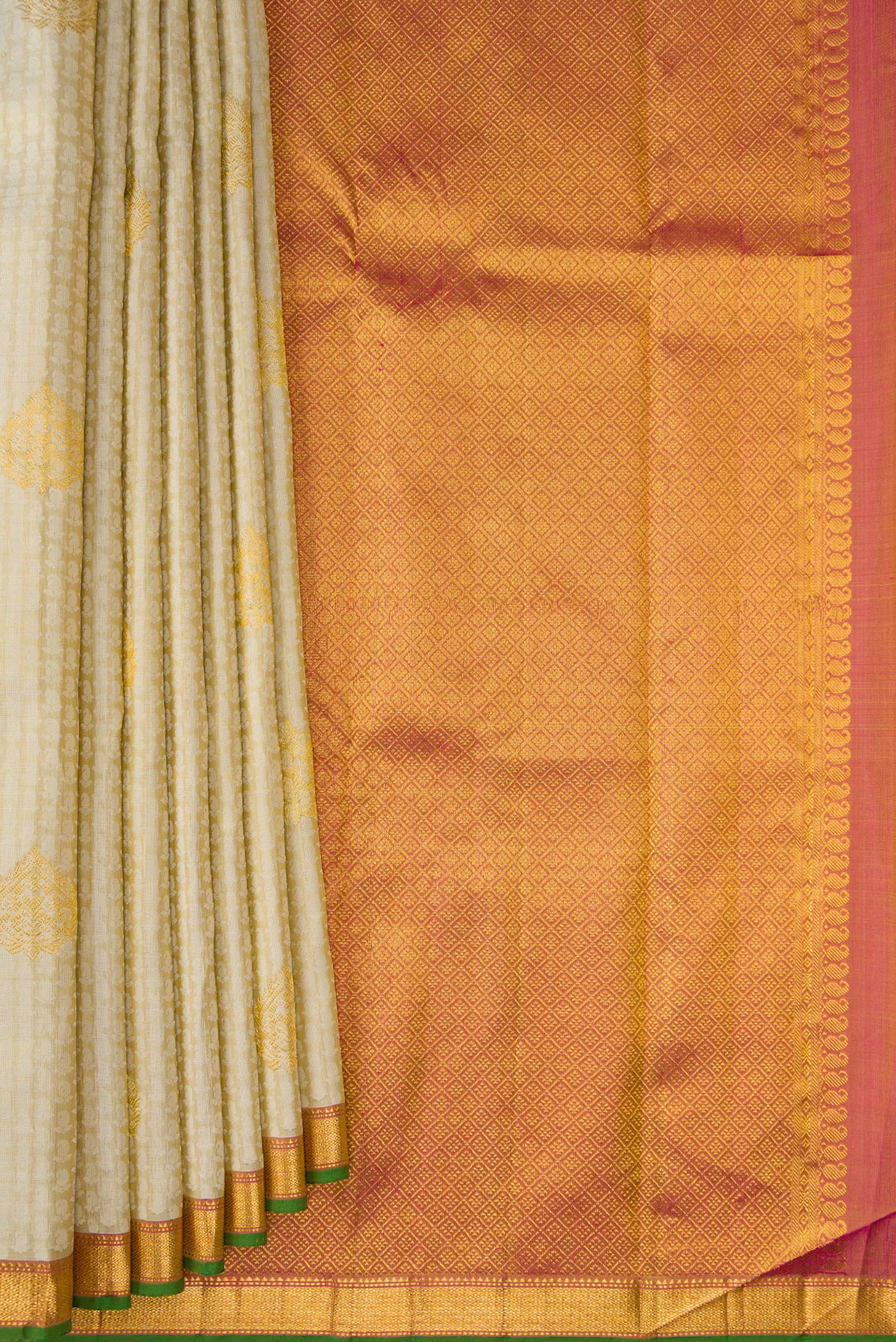 Pleats and pallu of Pure Silk Beige Kanjivaram Saree with Jacquard design on the body and Zari Border. 